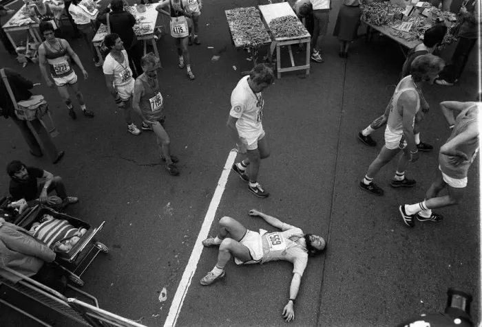 Framed Print : Marathon runners at the end of the London Marathon looking tired collecting their medals