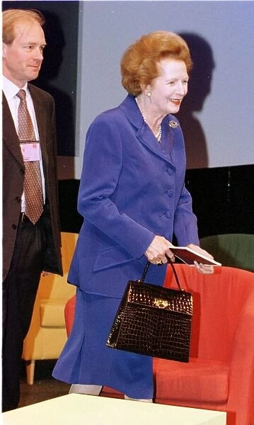 Margaret Thatcher Conservative Party Conference 1998 Is guided to her IKEA chair by