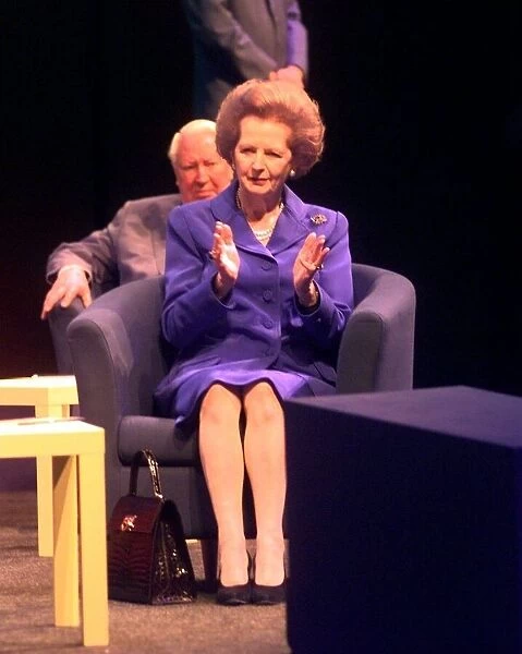 Margaret Thatcher the former Conservative Prime Minister of Britain claps during