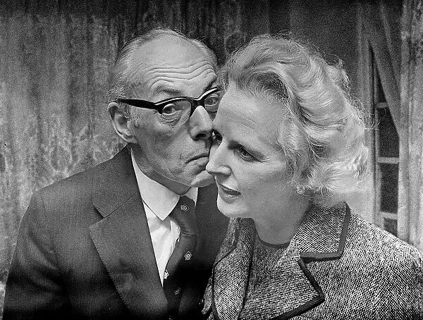 Margaret Thatcher with Denis Thatcher - February 1975 who kisses her on the cheek