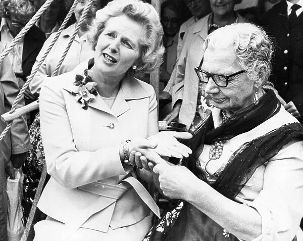 Margaret Thatcher having her fortune told by Molly Douglas during a visit to the North