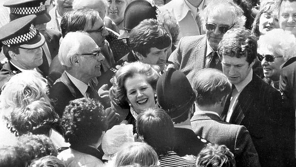 Margaret Thatcher and husband Denis surrounded by crowd