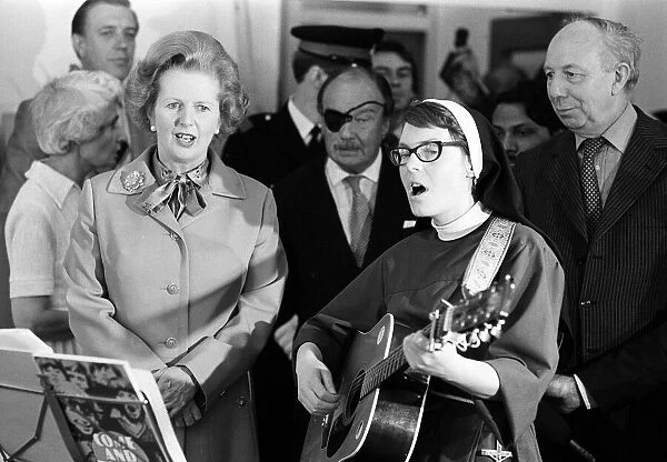 Margaret Thatcher July 1980 visits Toynbee Hall in the East End, singing with a nun