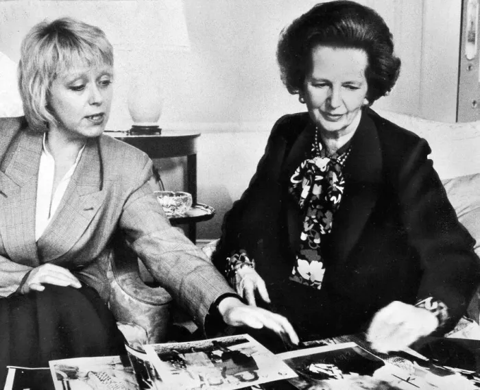Framed Print : Margaret Thatcher looking over photographs with official - May 1987 Framed Print : Margaret Thatcher looking over photographs with official - May 1987
