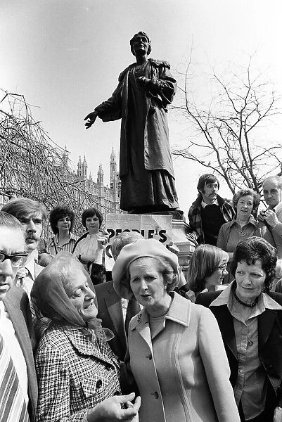 Margaret Thatcher in Pankhurst Gardens outside the Houses of Parliament standing under
