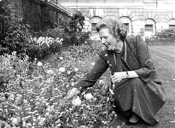 Margaret Thatcher picking flowers in garden - April 1987