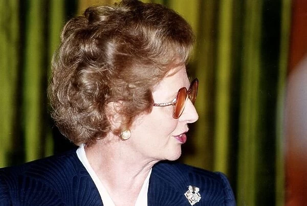 Margaret Thatcher Prime Minister and leader of Conservative Party wearing glasses 1990