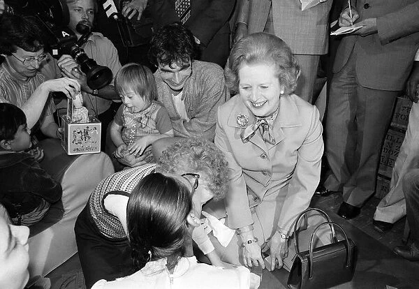 Margaret Thatcher visits Toynbee Hall in the East End with children July 1980