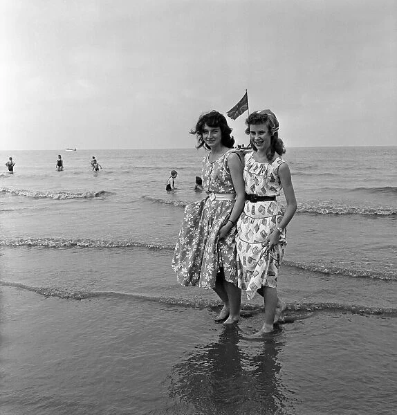 Margaret Wright and Ethel Foster of Wigan paddling in the sea at Blackpool, Lancashire