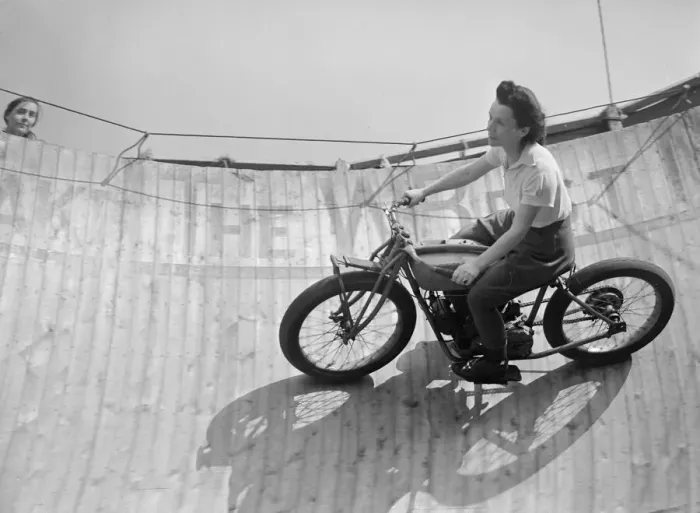 Framed Print : Margy Dare riding a motorbike around the Wall of Death at Morecambe in Lancashire Framed Print : Margy Dare riding a motorbike around the Wall of Death at Morecambe in Lancashire