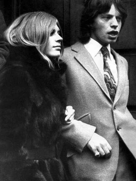 Marianne Faithfull and Mick Jagger on their way to court. 18th December 1969