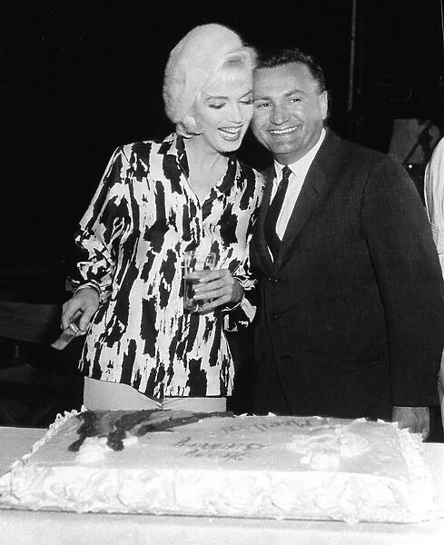 Marilyn Monroe actress with Unknown man cutting cake