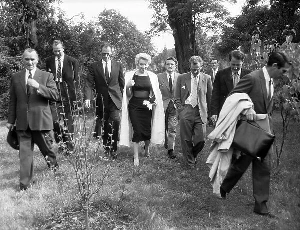 Marilyn Monroe and her husband, playwright Arthur Miller (3rd from the left)