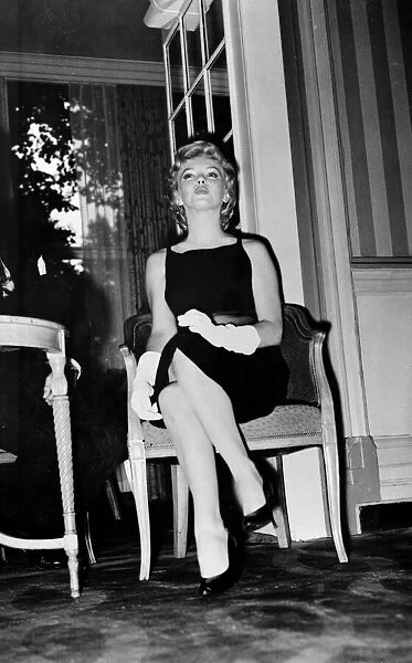 Marilyn Monroe July 1956 Actress Pictured sitting on a chair in hotel foyer for