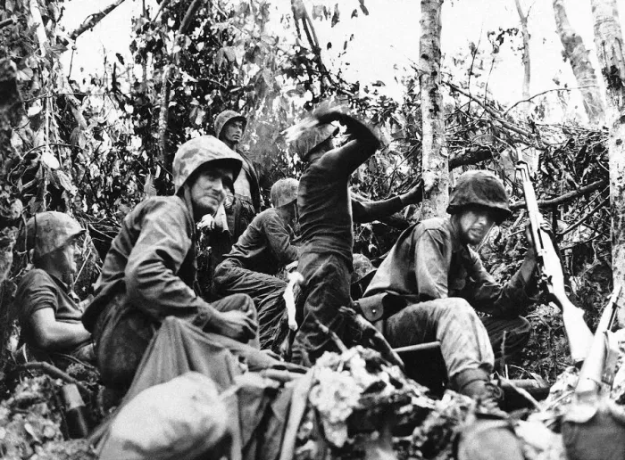 Framed Print : US marine about to throw a handgrenade at the enemy as his unit fights its way Framed Print : US marine about to throw a handgrenade at the enemy as his unit fights its way