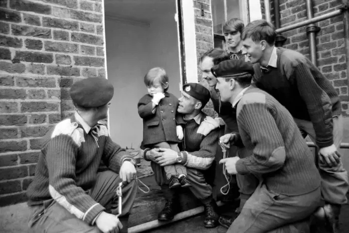 Framed Print : Mark Diment meets the six marines who are working on his special play area