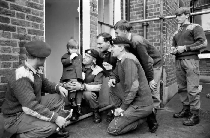 Framed Print : Mark Diment meets the six marines who are working on his special play area