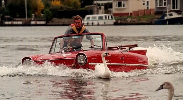 Mark Perkins from Ascot and his 1964 Amphicar March 1998, on the river Thames at Staines