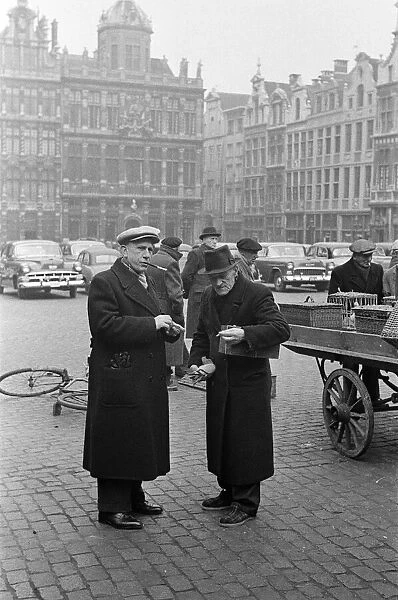 Market scenes in the Grand Place, the central square, Brussels, Belgium. 28th March 1955