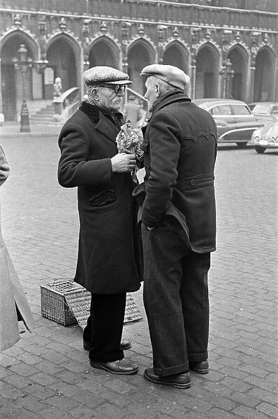 Market scenes in the Grand Place, the central square, Brussels, Belgium. 28th March 1955
