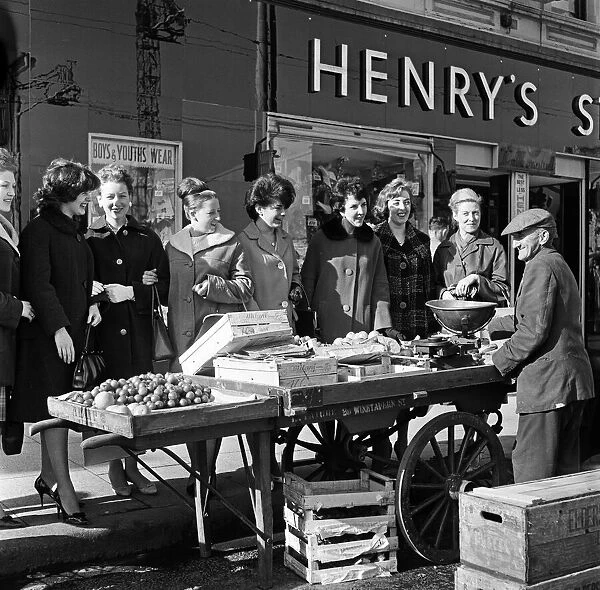 Market stall outside Henrys Stores, Belfast. Northern Ireland. 9th October 1963