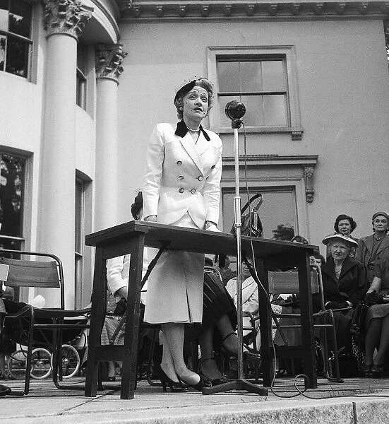 Marlene Dietrich speaking at The Holme, Regents Park, at a garden party that was held in