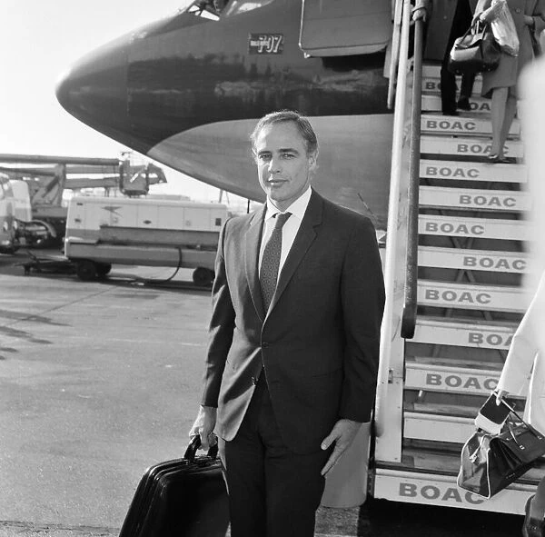Marlon Brando arrives at Heathrow Airport in London, to take part in a television
