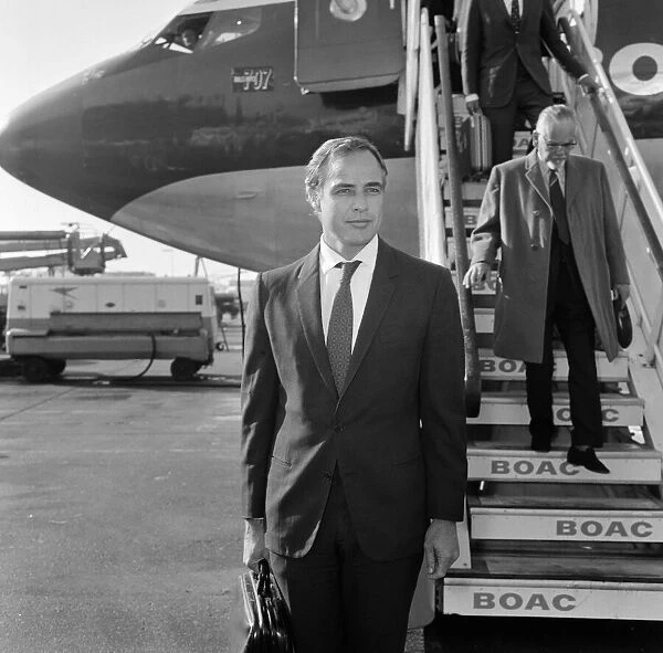Marlon Brando arrives at Heathrow Airport in London, to take part in a television