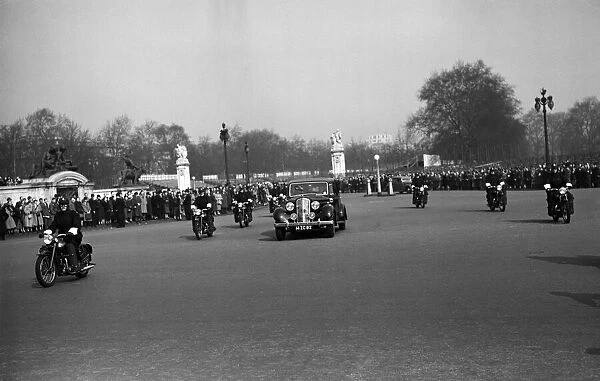 Marshal Tito, of Yugoslavia, arrives at Buckingham Palace with a motorcycle escort of