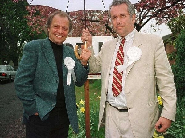 Martin Bell shares umbrella with actor David Sole during his election campaign April