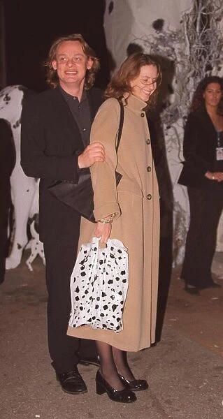 Martin Clunnes actor with unknown lady at the film premiere of 101 Dalmatians