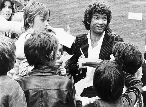 Martin Shaw Actor after the days filming for TV Progs The Proffesionals being swarmed by
