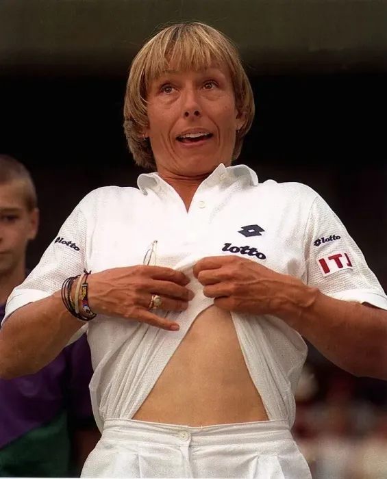 Framed Print : Martina Navratilova has the crowd in stitches as she apes Andre Agassi Framed Print : Martina Navratilova has the crowd in stitches as she apes Andre Agassi