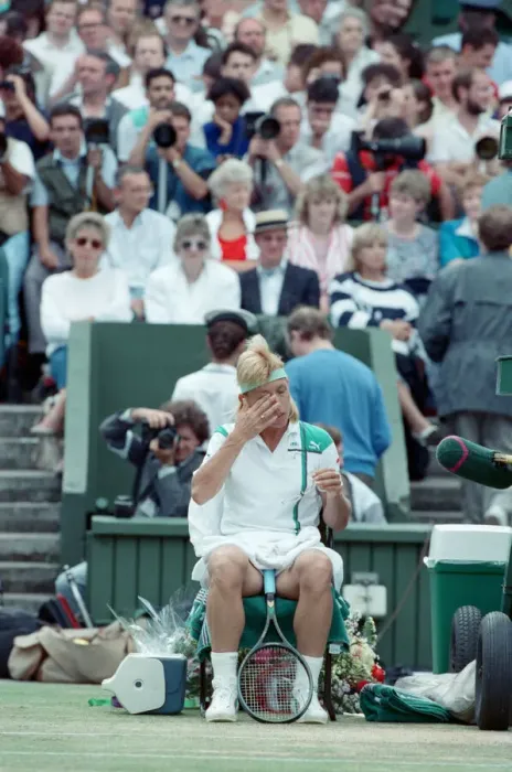 Framed Print : Martina Navratilova seated during a break at the Wimbledon final against Steffi Graf Framed Print : Martina Navratilova seated during a break at the Wimbledon final against Steffi Graf