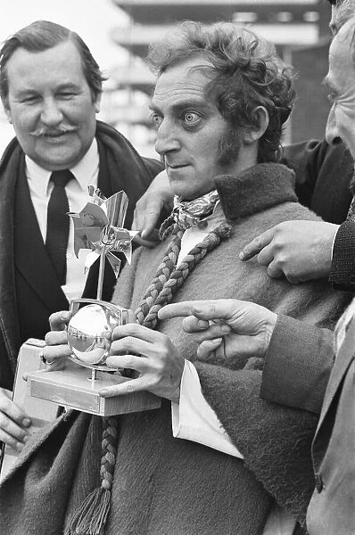 Marty Feldman seen here on his return from the Monteaux TV awards with his award for best