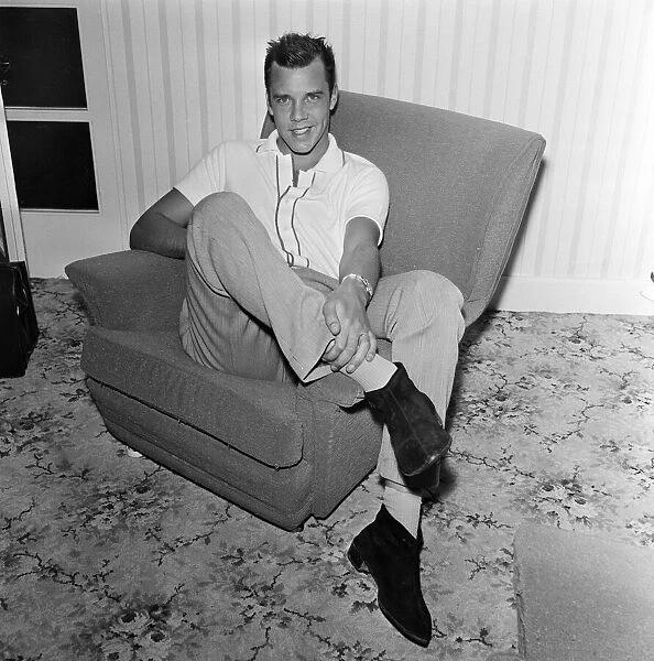 Marty Wilde at home in his flat in Chiswick, London. 21st April 1960