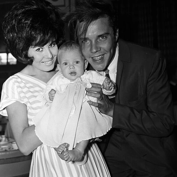 Marty Wilde at London Airport with his wife Joyce and their six month old daughter Kim