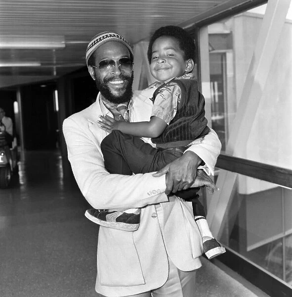 Marvin Gaye, singer with his son Frankie, aged 4, arriving at London Heathrow Airport