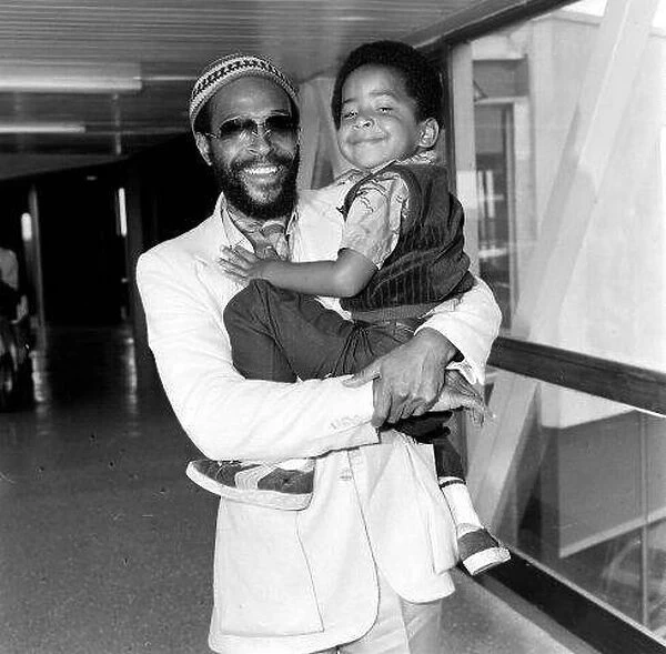 Marvin Gaye, singer with his son Frankie, aged 4, arriving at London Heathrow Airport