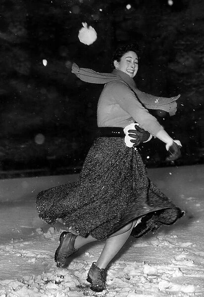 Mary Derby February 1953 in Farnborough Kent throwing snowballs