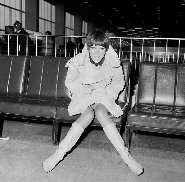 Mary Quant, at London Airport, on her way to Paris to go to a fancy dress ball