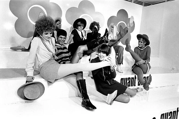 Mary Quant pictured in black, sitting down at the front
