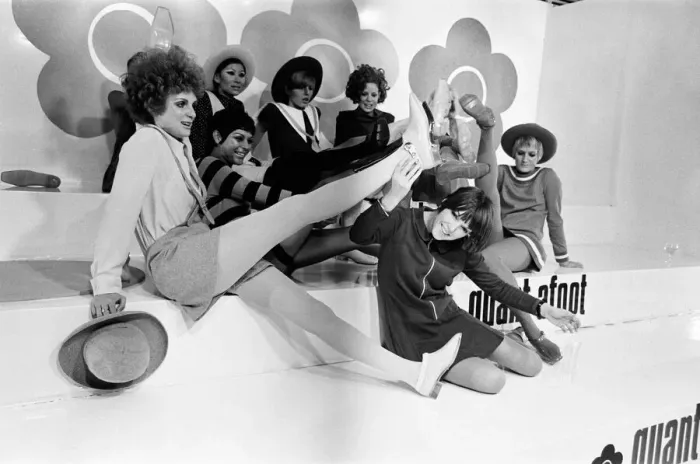 Framed Print : Mary Quant pictured in black, sitting down at the front Framed Print : Mary Quant pictured in black, sitting down at the front