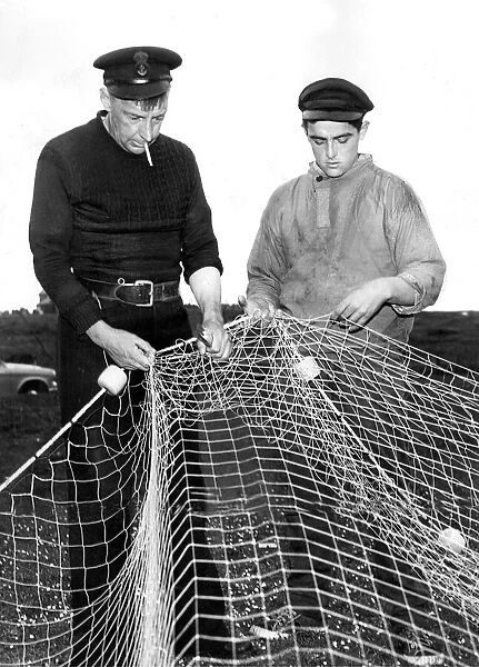 Matthew Stanton and Henry Rowe repairing their fishing net in whcih a whale became