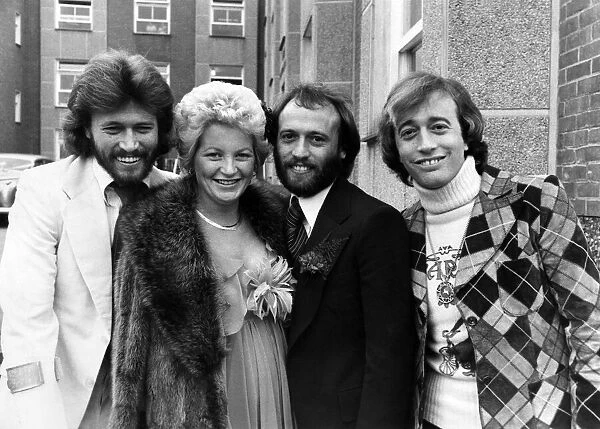 Maurice Gibb of the Bee Gees pop group (centre) with his bride Yvonne