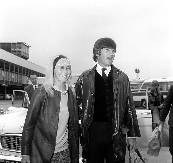 May 1964 John Lennon with his wife Cynthia walk to the car as they arrive back in England
