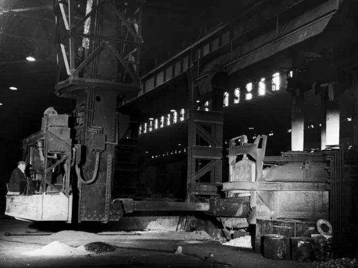 Framed Print : A mechanical charging machine feeding a 30 ton electric arc furnace at the English Steel Framed Print : A mechanical charging machine feeding a 30 ton electric arc furnace at the English Steel