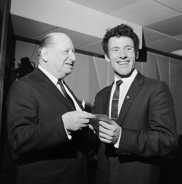 Media Mogul Lew Grade hands a cheque for £500 to 27 year old Tom Graham of