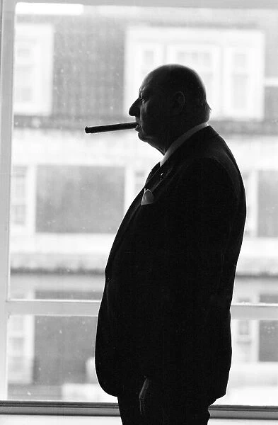 Media Mogul Lew Grade, head of ATV television, smoking of one of his trademark cigars