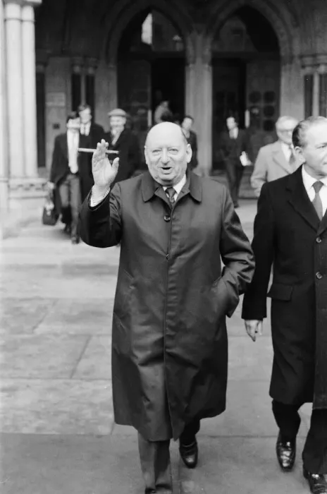 Framed Print : Media Mogul Lew Grade poses outside the High Court in London, smoking one of his cigars